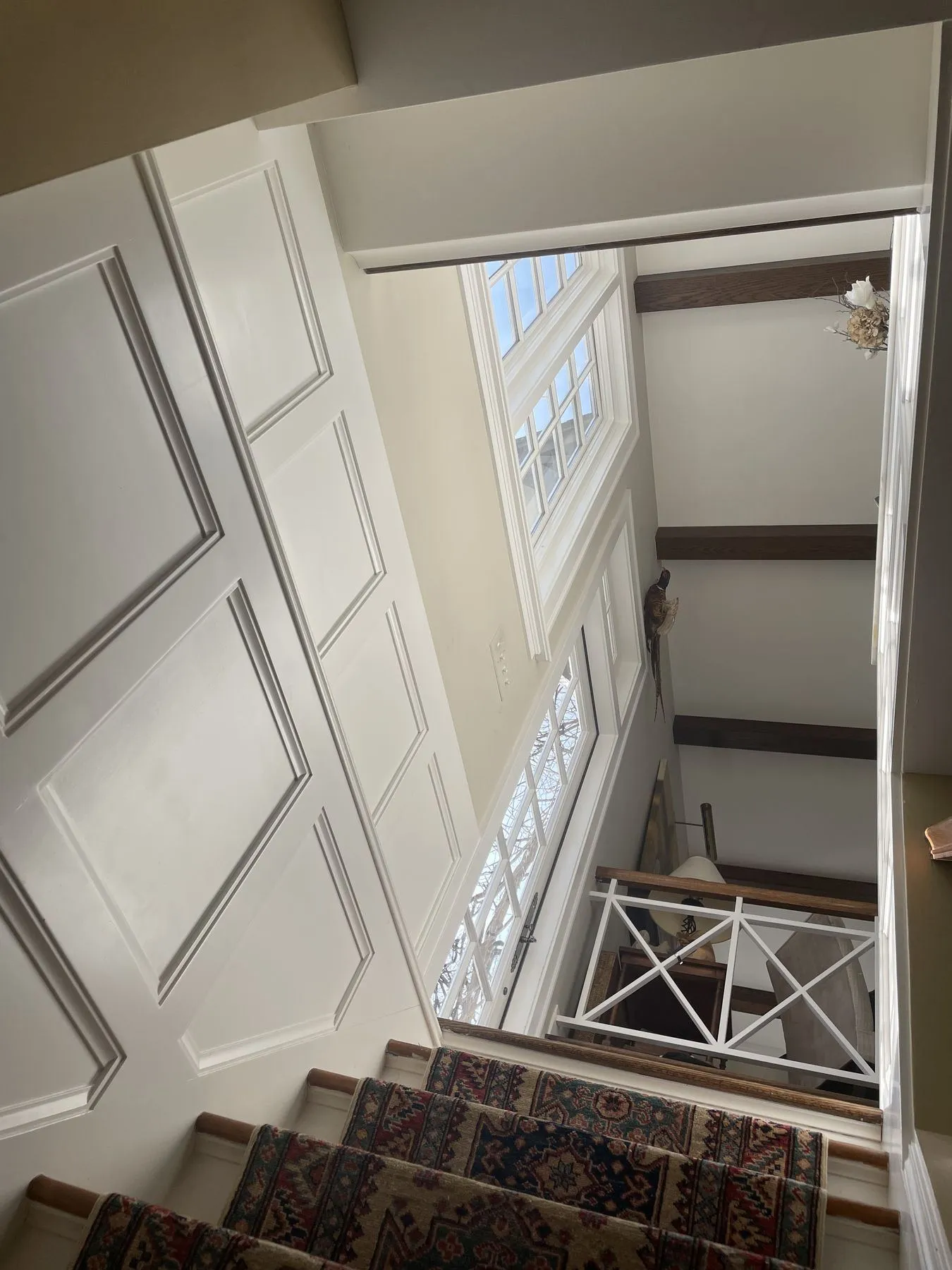 Looking down the paneled stairway to the lower level