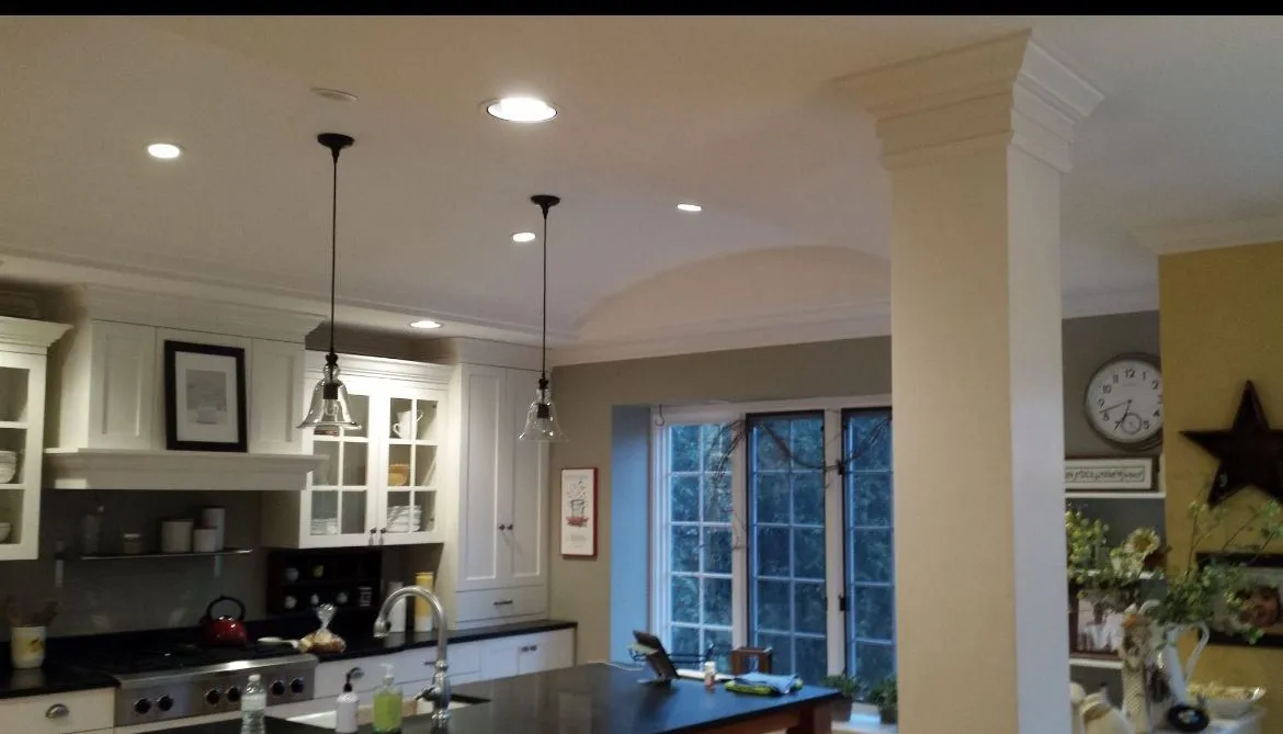 Inside the addition, with a barrel ceiling and a column at the kitchen